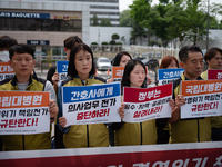 Representatives from the National University Hospitals' Labor Union Joint Struggle Alliance are holding a joint press conference in front of...