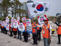 Representatives from the Central Social Organizations Federation are holding a rally in front of the Presidential Office in Yongsan-gu, Seou...