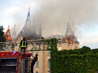 Rescuers are operating a fire engine outside the Palace of Students of the Odesa Law Academy, which caught fire due to a Russian missile att...