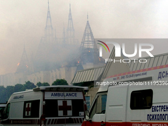 An ambulance is parked outside the Palace of Students of the Odesa Law Academy, which is on fire due to a Russian missile attack in Odesa, U...