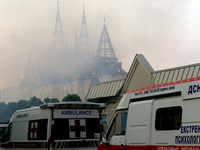 An ambulance is parked outside the Palace of Students of the Odesa Law Academy, which is on fire due to a Russian missile attack in Odesa, U...