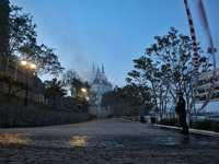 A police officer is standing guard outside the Palace of Students of the Odesa Law Academy, which is on fire as a result of a Russian missil...