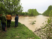 Kashmiri farmers are inspecting their orchards that have been washed away by flash floods in Nathipora Sopore, District Baramulla, Jammu and...