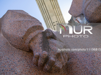 Workers are dismantling the monument commemorating the Pereiaslav Agreement under the Arch of Freedom of the Ukrainian People, formerly know...