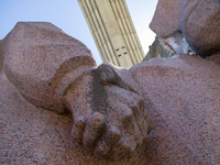 Workers are dismantling the monument commemorating the Pereiaslav Agreement under the Arch of Freedom of the Ukrainian People, formerly know...