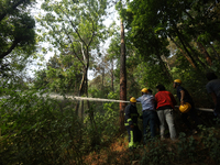 Nepali firefighters are using water cannons to control a blaze that started in a local forest in the Lalitpur District of Central Nepal, on...