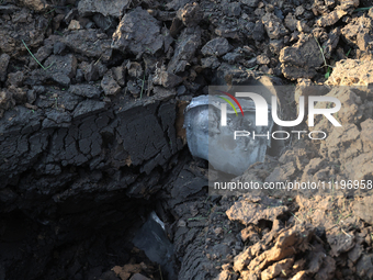 A fragment of a Russian guided bomb is lying on the ground in the Kyivskyi district of Kharkiv, northeastern Ukraine, on April 29, 2024. NO...