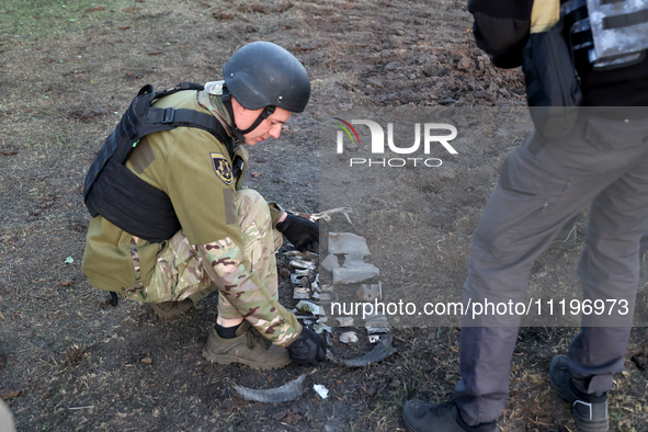 An expert is working at the scene where Russian guided bombs landed in Kharkiv, northeastern Ukraine, on April 29, 2024. NO USE RUSSIA. NO U...