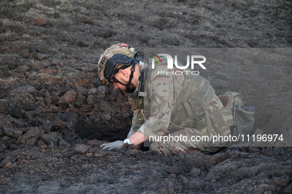 An expert is working at the scene where Russian guided bombs landed in Kharkiv, northeastern Ukraine, on April 29, 2024. NO USE RUSSIA. NO U...