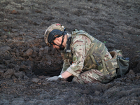 An expert is working at the scene where Russian guided bombs landed in Kharkiv, northeastern Ukraine, on April 29, 2024. NO USE RUSSIA. NO U...