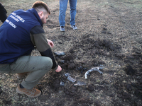 A war crimes prosecutor is collecting the fragments of guided bombs launched by the Russian troops in Kharkiv, northeastern Ukraine, on Apri...