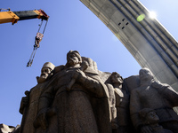 The dismantling of the Soviet monument symbolizing friendship between the Ukrainian and Russian peoples is continuing in central Kyiv, Ukrai...