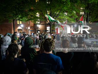 Students rally at a Gaza solidarity encampment at George Washington University, Washington, DC, April, 29, 2024.  GWU students have maintain...