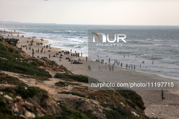 Palestinians are enjoying the beach at the Nuseirat refugee camp in the central Gaza Strip, on April 30, 2024, amid the ongoing conflict in...