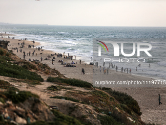 Palestinians are enjoying the beach at the Nuseirat refugee camp in the central Gaza Strip, on April 30, 2024, amid the ongoing conflict in...