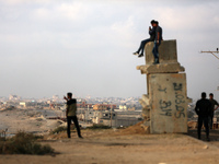 Palestinians are walking along the coastal Rashid road in the Nuseirat refugee camp in the central Gaza Strip on April 30, 2024, amid the on...