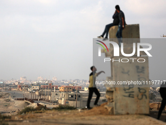 Palestinians are walking along the coastal Rashid road in the Nuseirat refugee camp in the central Gaza Strip on April 30, 2024, amid the on...