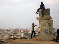 Palestinians are walking along the coastal Rashid road in the Nuseirat refugee camp in the central Gaza Strip on April 30, 2024, amid the on...