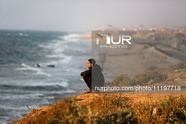 Palestinians are walking along the coastal Rashid road in the Nuseirat refugee camp in the central Gaza Strip on April 30, 2024, amid the on...