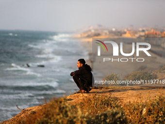 Palestinians are walking along the coastal Rashid road in the Nuseirat refugee camp in the central Gaza Strip on April 30, 2024, amid the on...