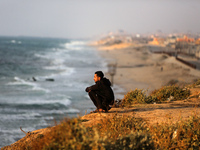 Palestinians are walking along the coastal Rashid road in the Nuseirat refugee camp in the central Gaza Strip on April 30, 2024, amid the on...