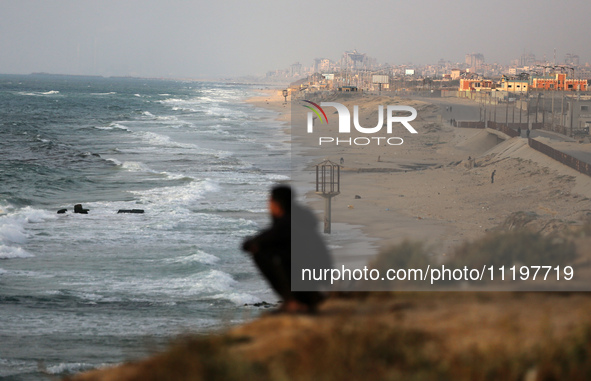 Palestinians are walking along the coastal Rashid road in the Nuseirat refugee camp in the central Gaza Strip on April 30, 2024, amid the on...