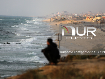 Palestinians are walking along the coastal Rashid road in the Nuseirat refugee camp in the central Gaza Strip on April 30, 2024, amid the on...