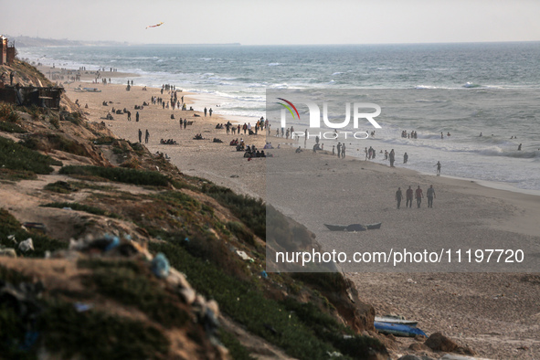 Palestinians are enjoying the beach at the Nuseirat refugee camp in the central Gaza Strip, on April 30, 2024, amid the ongoing conflict in...