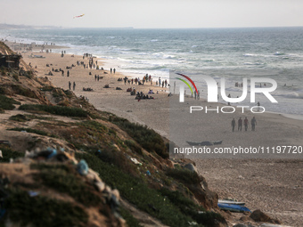 Palestinians are enjoying the beach at the Nuseirat refugee camp in the central Gaza Strip, on April 30, 2024, amid the ongoing conflict in...