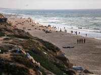 Palestinians are enjoying the beach at the Nuseirat refugee camp in the central Gaza Strip, on April 30, 2024, amid the ongoing conflict in...