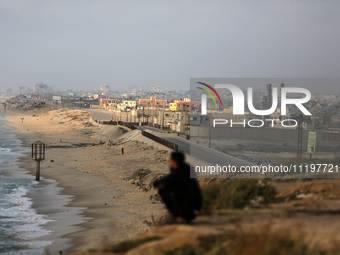 Palestinians are walking along the coastal Rashid road in the Nuseirat refugee camp in the central Gaza Strip on April 30, 2024, amid the on...