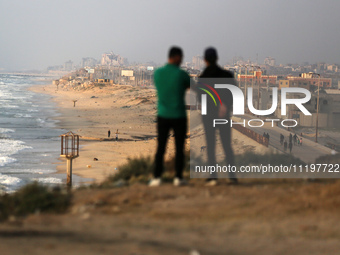 Palestinians are walking along the coastal Rashid road in the Nuseirat refugee camp in the central Gaza Strip on April 30, 2024, amid the on...