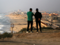 Palestinians are walking along the coastal Rashid road in the Nuseirat refugee camp in the central Gaza Strip on April 30, 2024, amid the on...