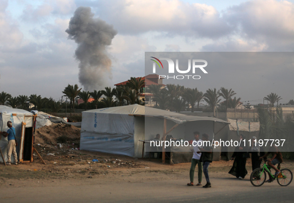 A smoke plume is billowing following Israeli bombardment in Deir Al-Balah, in the central Gaza Strip, on April 30, 2024, amid the ongoing co...