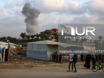 A smoke plume is billowing following Israeli bombardment in Deir Al-Balah, in the central Gaza Strip, on April 30, 2024, amid the ongoing co...