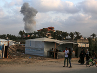 A smoke plume is billowing following Israeli bombardment in Deir Al-Balah, in the central Gaza Strip, on April 30, 2024, amid the ongoing co...