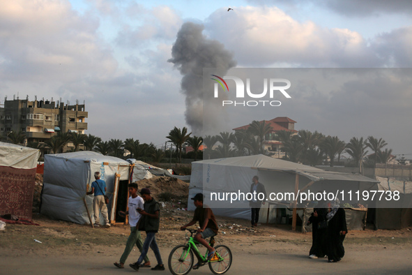 A smoke plume is billowing following Israeli bombardment in Deir Al-Balah, in the central Gaza Strip, on April 30, 2024, amid the ongoing co...