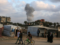 A smoke plume is billowing following Israeli bombardment in Deir Al-Balah, in the central Gaza Strip, on April 30, 2024, amid the ongoing co...