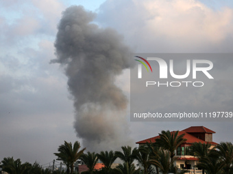 A smoke plume is billowing following Israeli bombardment in Deir Al-Balah, in the central Gaza Strip, on April 30, 2024, amid the ongoing co...