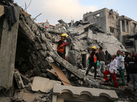 Palestinians are inspecting the damage to buildings after an Israeli bombardment in Deir Al-Balah, in the central Gaza Strip, on April 30, 2...