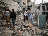 Palestinians are inspecting the damage to buildings after an Israeli bombardment in Deir Al-Balah, in the central Gaza Strip, on April 30, 2...