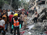 Palestinians are inspecting the damage to buildings after an Israeli bombardment in Deir Al-Balah, in the central Gaza Strip, on April 30, 2...