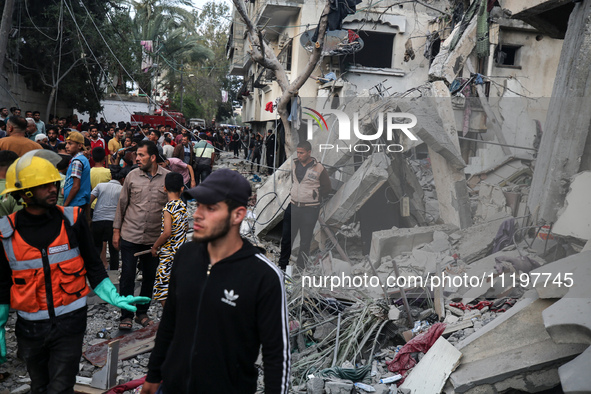 Palestinians are inspecting the damage to buildings after an Israeli bombardment in Deir Al-Balah, in the central Gaza Strip, on April 30, 2...