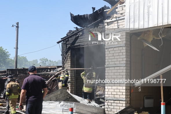 Rescuers are dealing with the aftermath of a Russian KAB aerial bomb attack in Kharkiv, northeastern Ukraine, on April 30, 2024. 