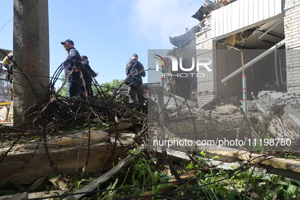 Rescuers are dealing with the aftermath of a Russian KAB aerial bomb attack in Kharkiv, northeastern Ukraine, on April 30, 2024. 