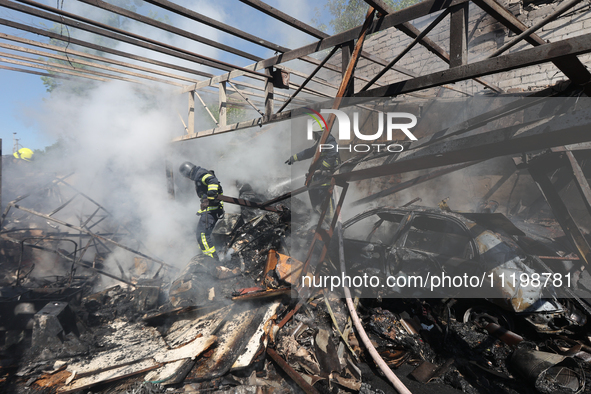 Rescuers are dealing with the aftermath of a Russian KAB aerial bomb attack in Kharkiv, northeastern Ukraine, on April 30, 2024. 