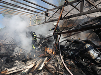 Rescuers are dealing with the aftermath of a Russian KAB aerial bomb attack in Kharkiv, northeastern Ukraine, on April 30, 2024. (