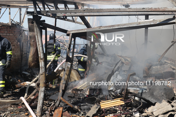 Rescuers are dealing with the aftermath of a Russian KAB aerial bomb attack in Kharkiv, northeastern Ukraine, on April 30, 2024. 