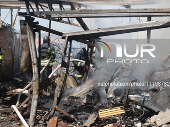 Rescuers are dealing with the aftermath of a Russian KAB aerial bomb attack in Kharkiv, northeastern Ukraine, on April 30, 2024. (