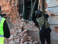 Law enforcers are documenting the destruction caused by the strike of Russian KAB guided bombs in Kharkiv, northeastern Ukraine, on April 30...